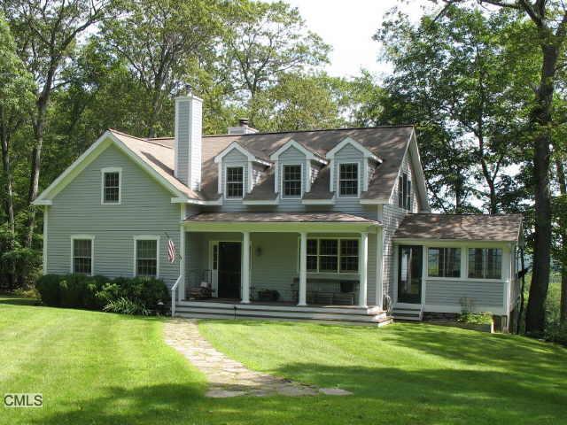32 Iron Mountain Road Kent, CT 06757 - Photo 1 of 1 a front view of a house with a garden