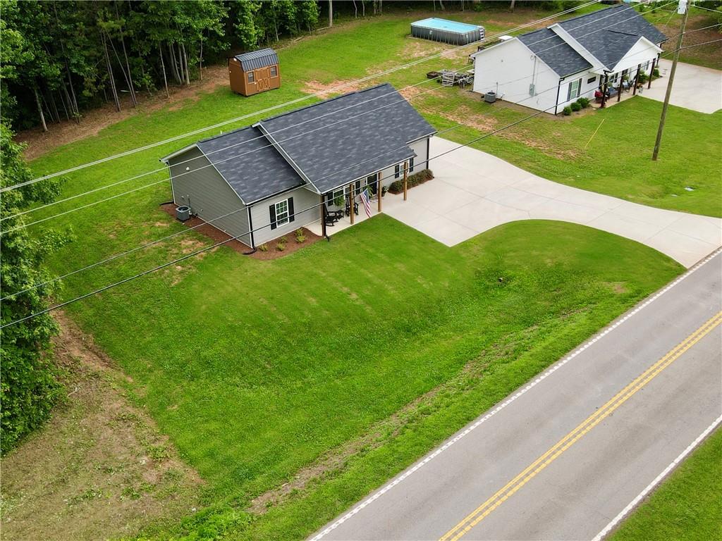 1776 Pleasant Grove Road Temple, GA 30179 - Photo 41 of 45 a view of a house with a yard table and chairs