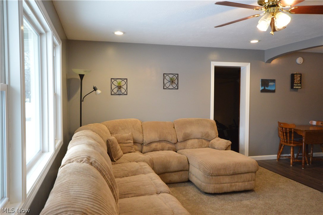 4378 Lane Road Painesville, OH 44077 - Photo 13 of 31 Living room with ceiling fan, recessed lighting, newer trim and carpet.