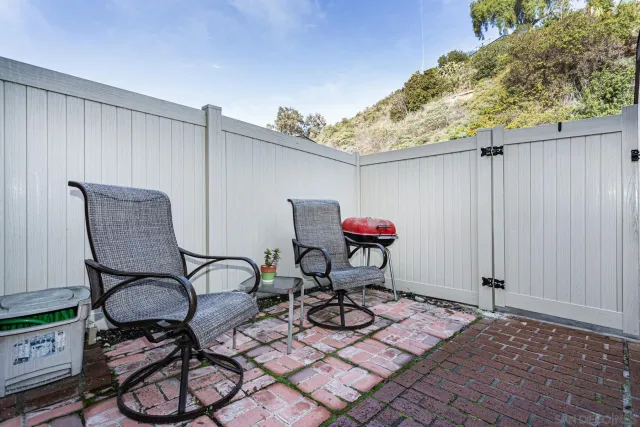 a patio with table and chairs