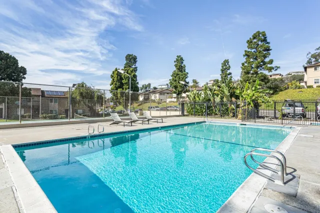 a view of a swimming pool with a patio