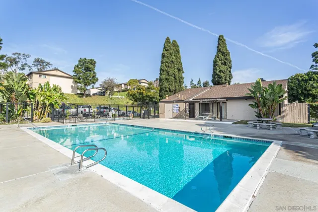 a house with swimming pool in front of it