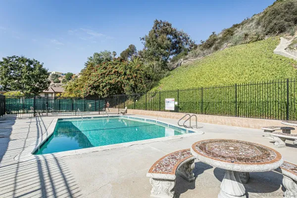 a view of a swimming pool with a patio