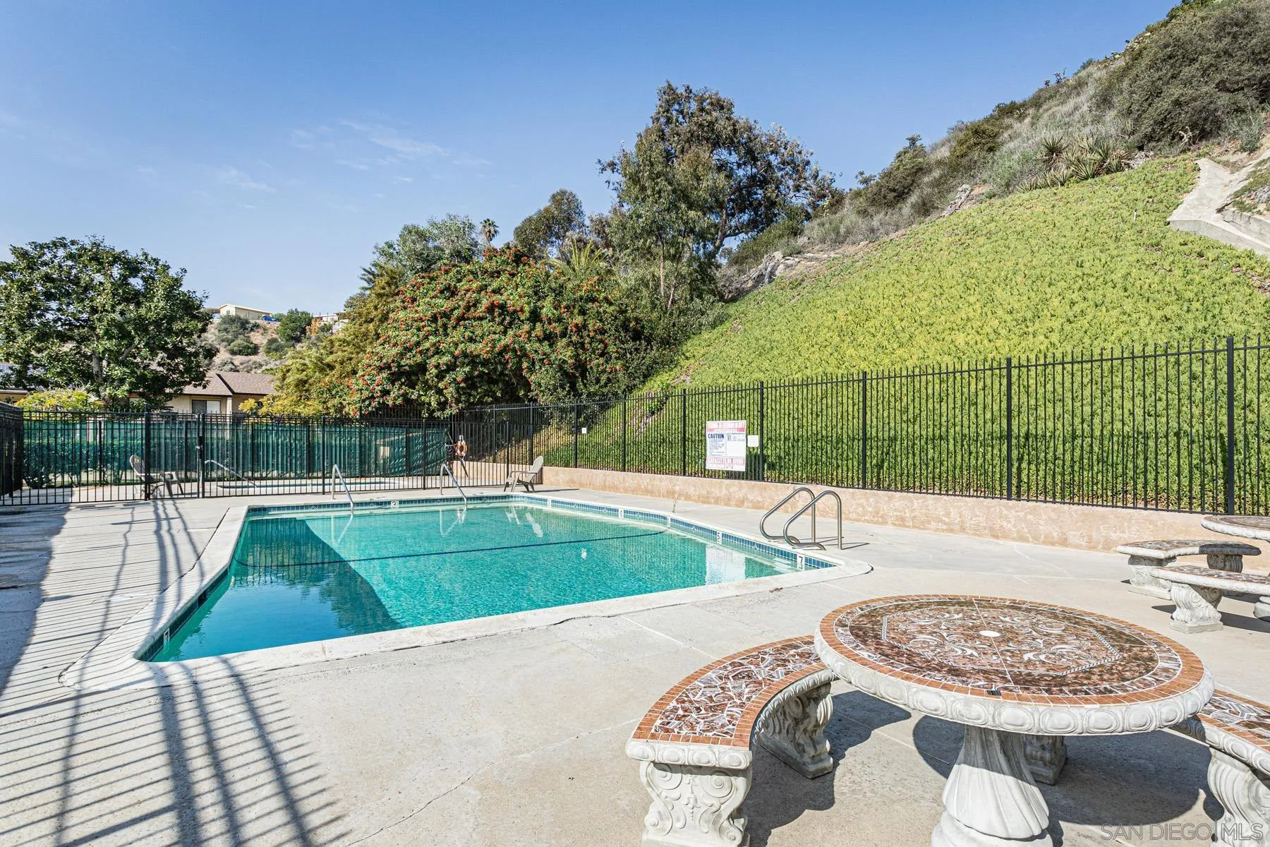 3433 Fairlomas Road National City, CA 91950 - Photo 30 of 43 a view of a swimming pool with a patio