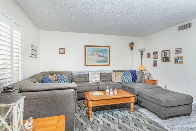 a living room with furniture and a couch