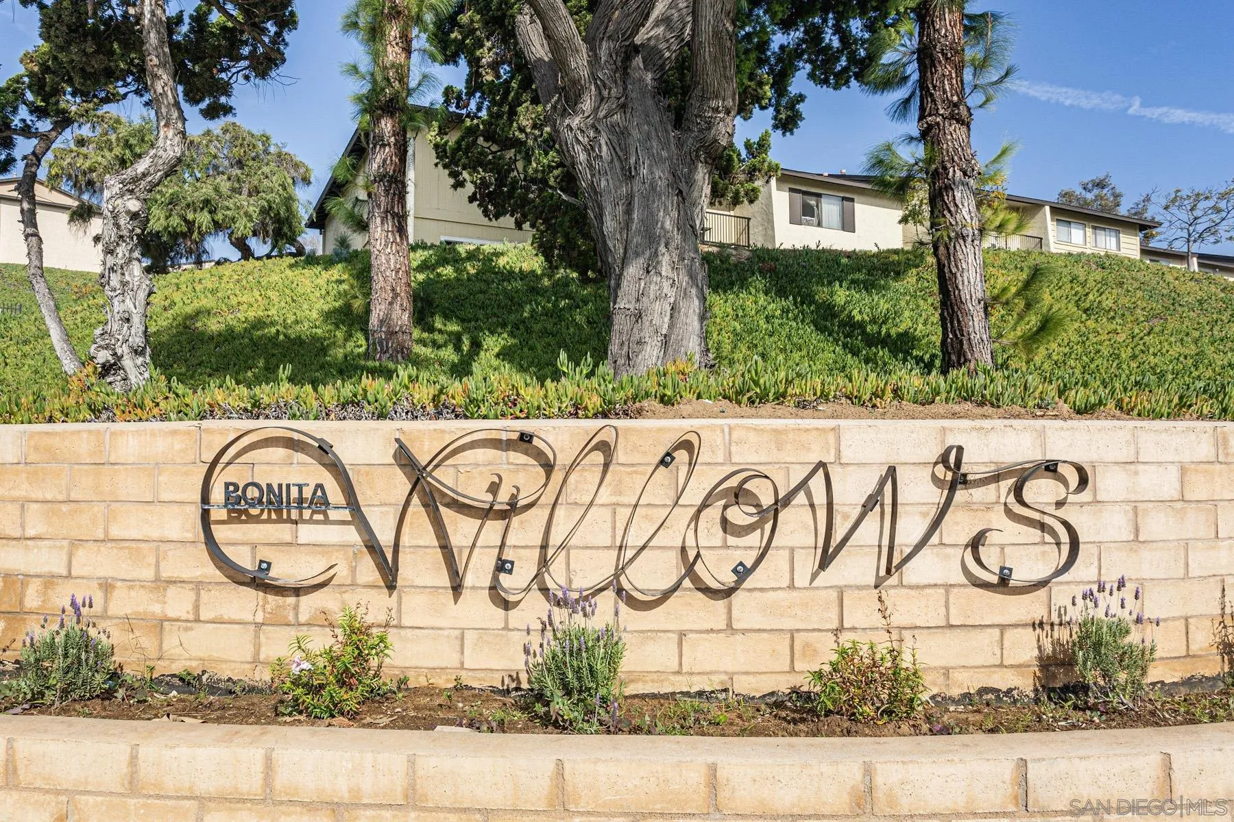 3433 Fairlomas Road National City, CA 91950 - Photo 42 of 43 a street sign on a wall next to a road