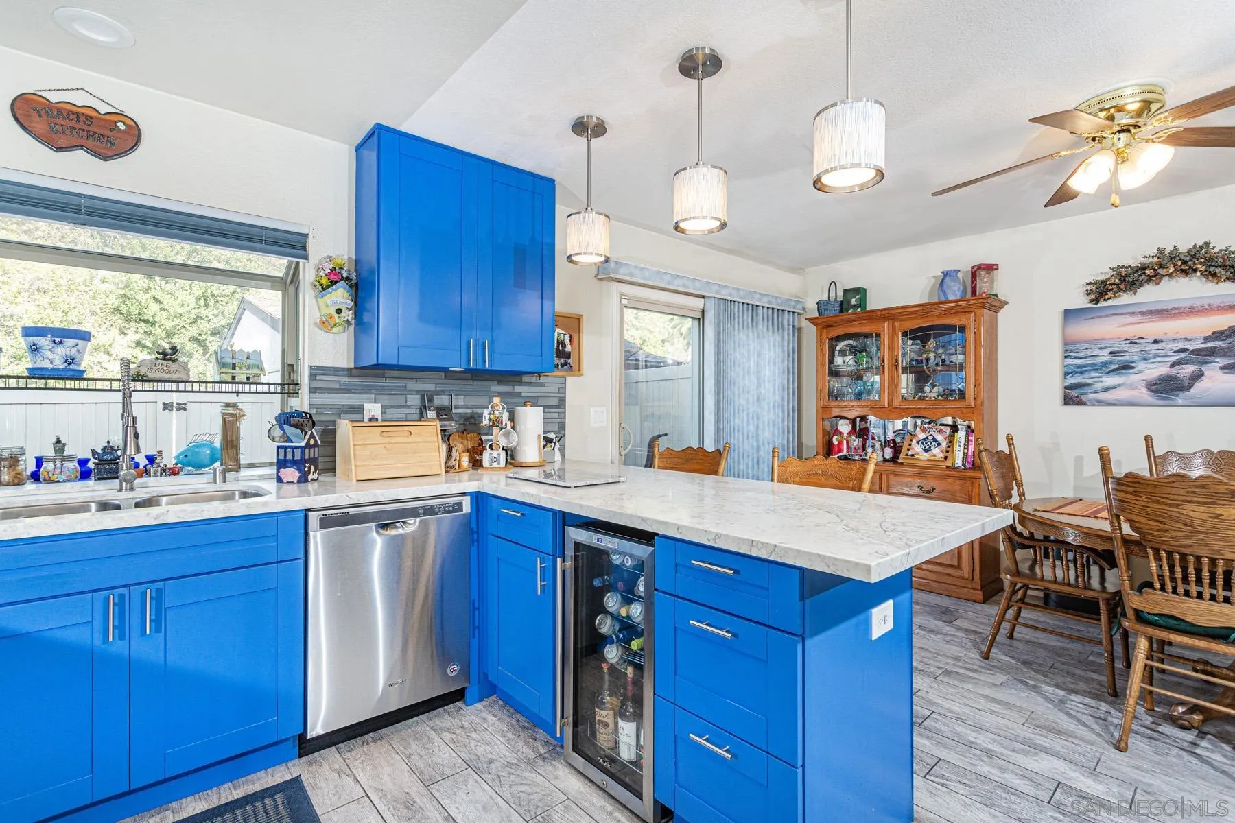 3433 Fairlomas Road National City, CA 91950 - Photo 7 of 43 a kitchen with stainless steel appliances granite countertop a sink dishwasher stove and wooden cabinets