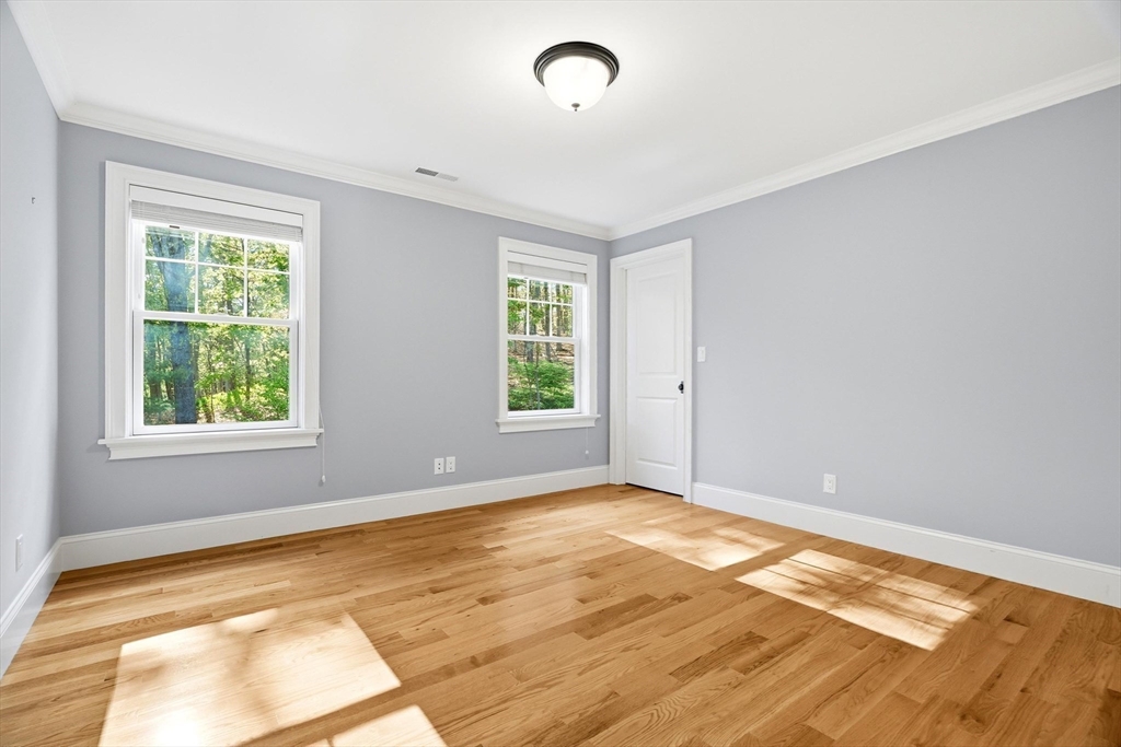 6 Flintlock Road Lexington, MA 02420 - Photo 29 of 39 a view of an empty room with a window