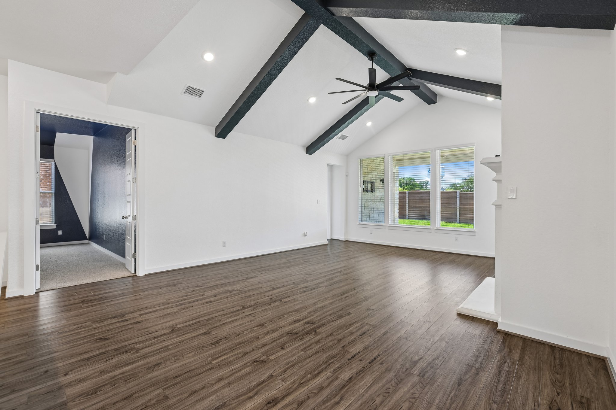 317 Independence Drive Kyle, TX 78640 - Photo 15 of 40 wooden floor in an empty room with a window