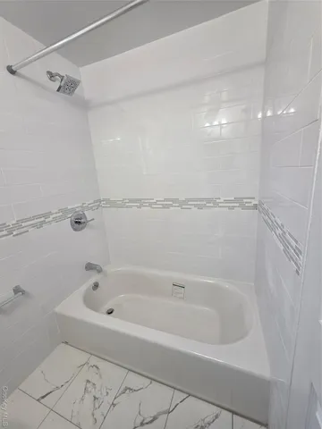 a close view of a bathtub in bathroom