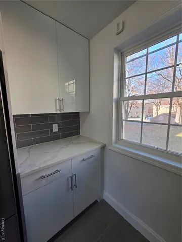 a view of cabinets and window