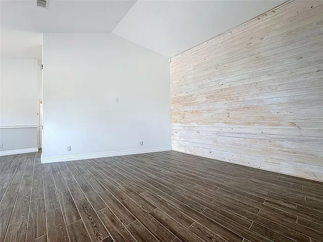 a room with a dresser and a mirror