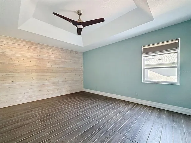 a kitchen with a dining table chairs and white appliances