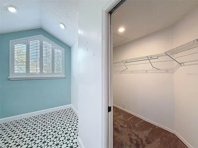 a kitchen with stainless steel appliances granite countertop a sink dishwasher a stove a refrigerator a microwave oven with cabinets and wooden floor