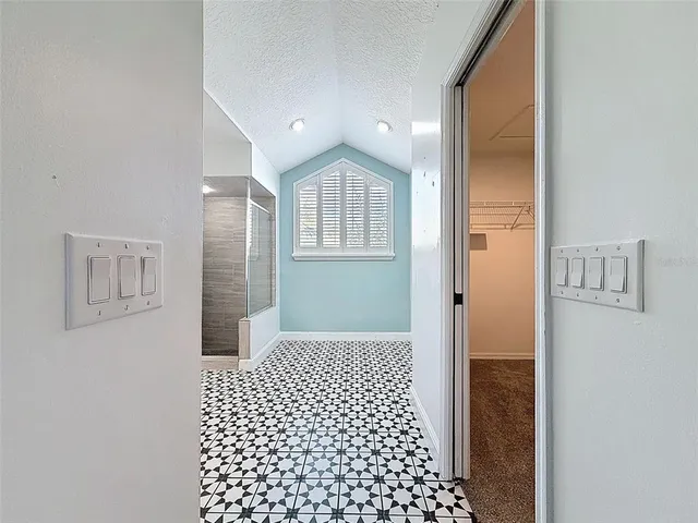 a kitchen with stainless steel appliances granite countertop a stove top oven a sink a counter space and cabinets