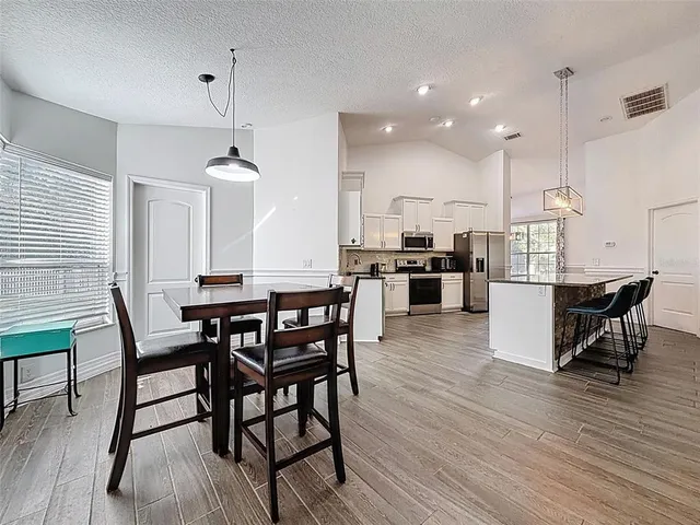 a view of a house with a yard porch and sitting area