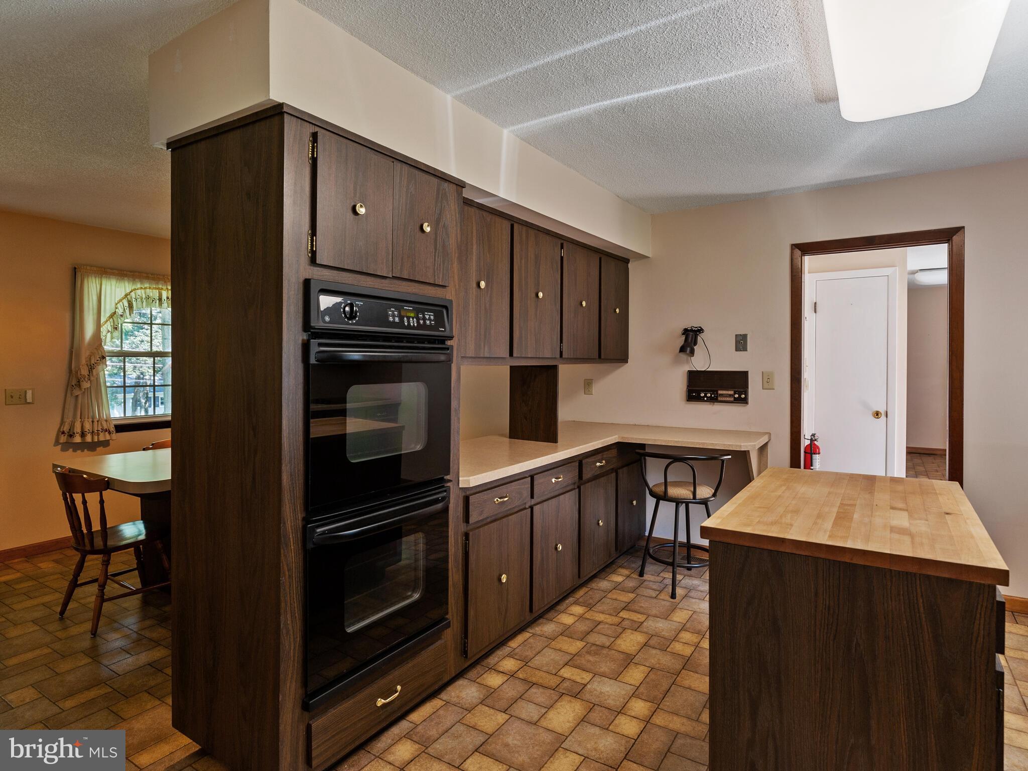 21 Forest Lane Ewing, NJ 08628 - Photo 7 of 23 Wood cabinets and black appliances