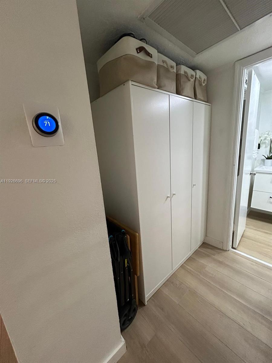 5838 Collins Avenue, Unit 11D Miami Beach, FL 33140 - Photo 16 of 24 a view of a hardwood & cabinets