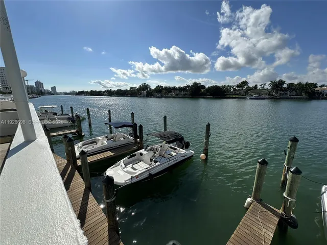 a view of a balcony with dining table and chair with wooden floor