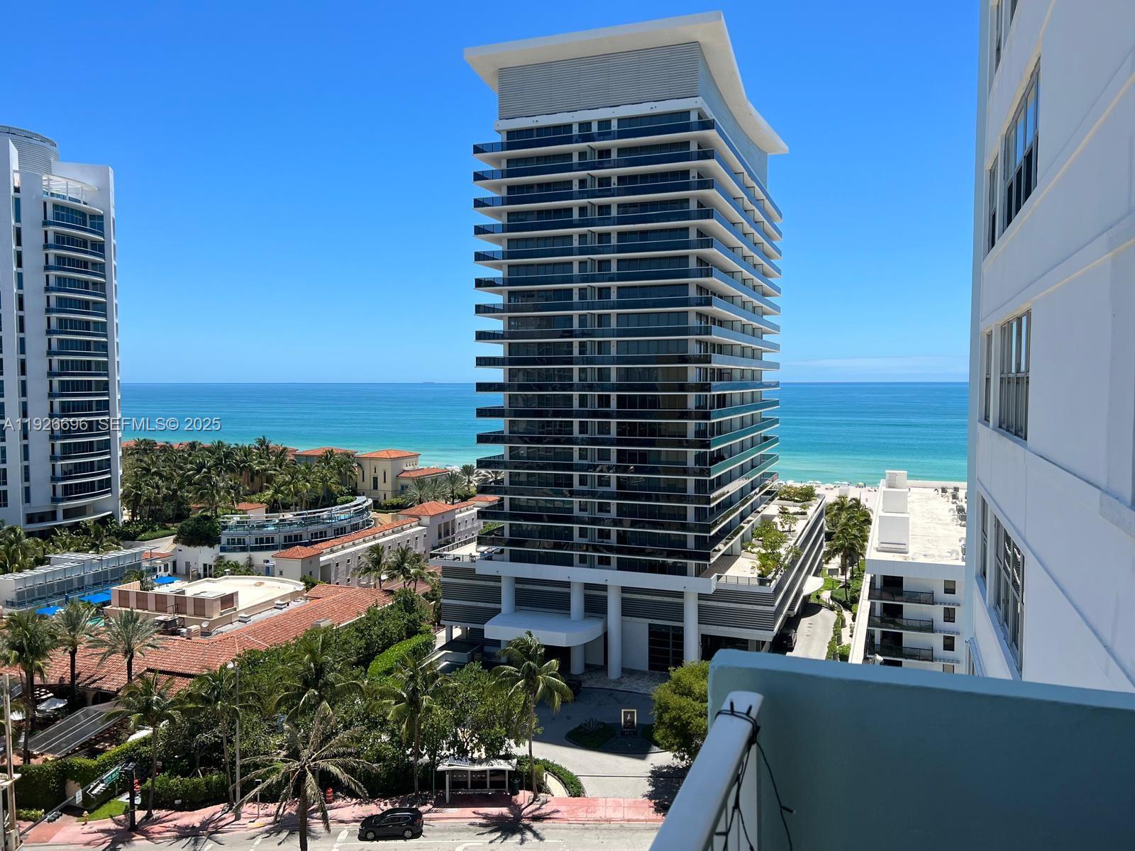 5838 Collins Avenue, Unit 11D Miami Beach, FL 33140 - Photo 2 of 24 a view of a balcony with potted plants and city view
