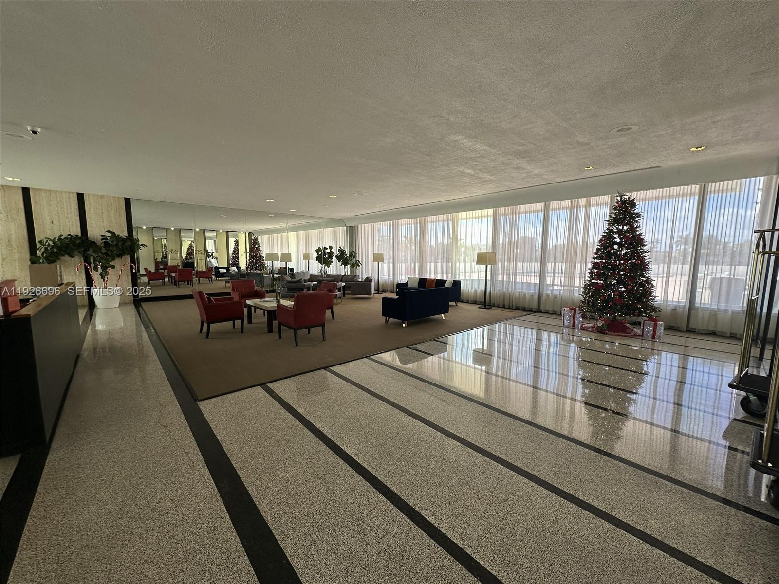 5838 Collins Avenue, Unit 11D Miami Beach, FL 33140 - Photo 22 of 24 a living room with furniture