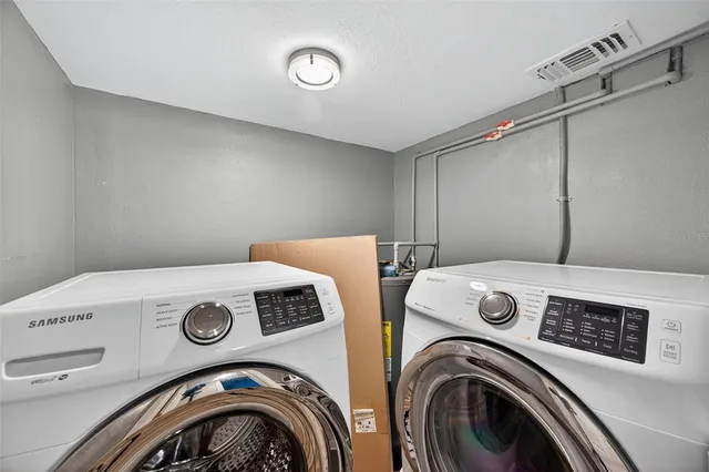 a utility room with dryer and washer