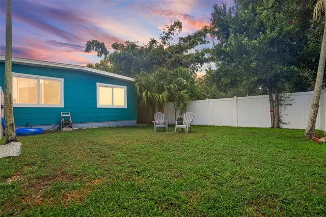 a house with a tree in front of it