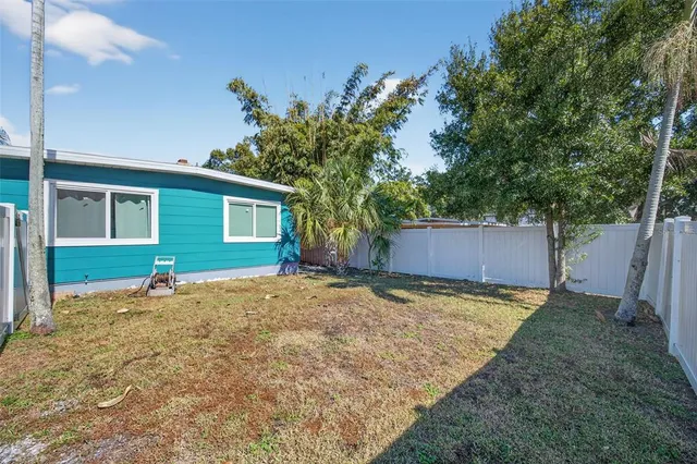 a house view with a backyard space