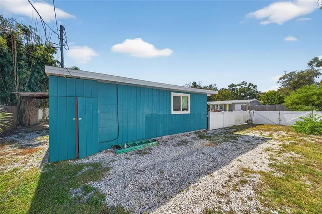 a view of backyard of a house