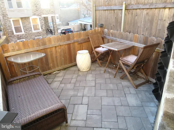 a view of a chairs and table on the terrace