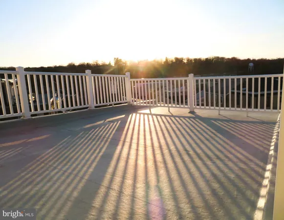 a view of deck with wooden floor and fence