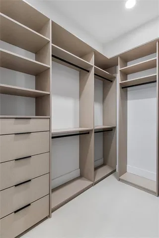 a view of an empty walk in closet
