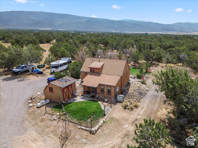 11450 Pigeon Hollow Road Spring City, UT 84662 - Photo 2 of 47 Aerial view of property and surrounding area with a mountainous background
