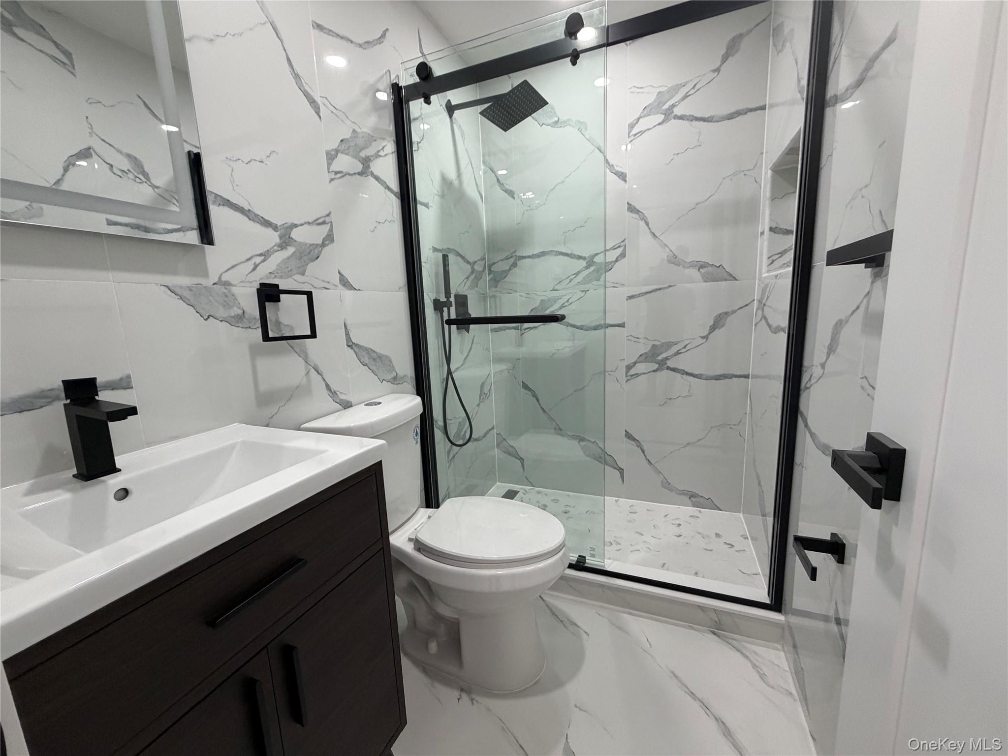 126-22 146th Street Queens, NY 11436 - Photo 15 of 20 a bathroom with a sink toilet and shower