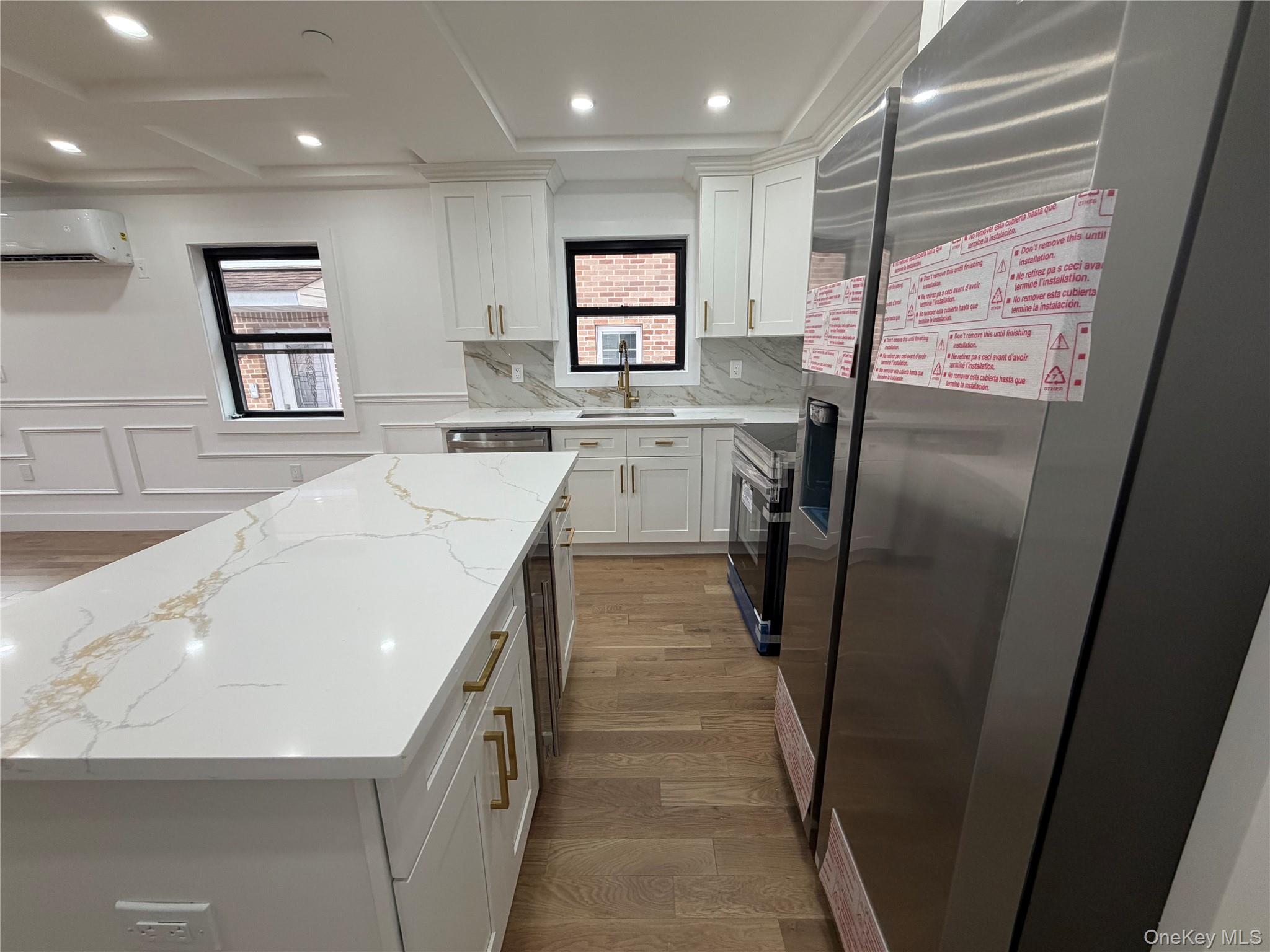 126-22 146th Street Queens, NY 11436 - Photo 6 of 20 a kitchen with refrigerator and window