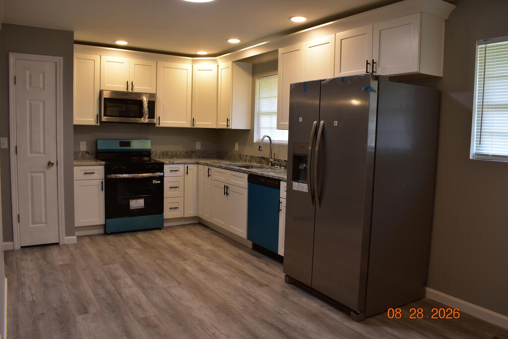 171 Farrar Road Cohutta, GA 30710 - Photo 13 of 24 Kitchen, New white shaker style cabinets, , granite countertops, new stainless appliances.
