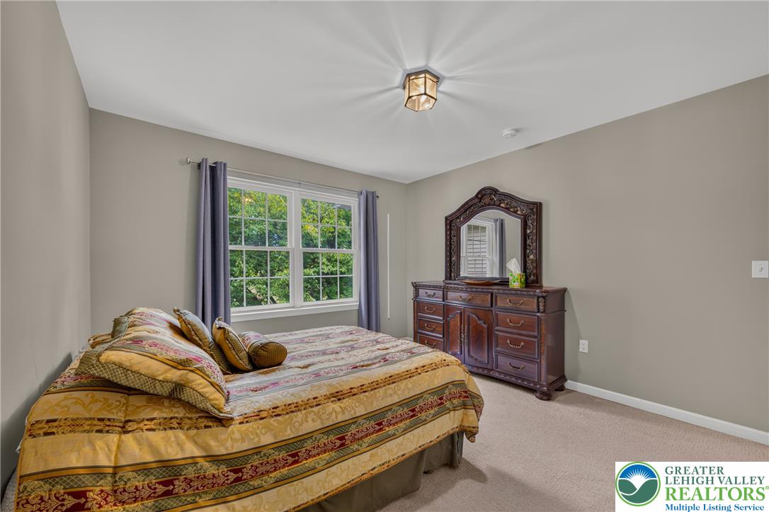 4236 Creek Road Allentown, PA 18104 - Photo 26 of 47 Plush carpeting and a classic multi-lite window define this relaxing sleeping space.