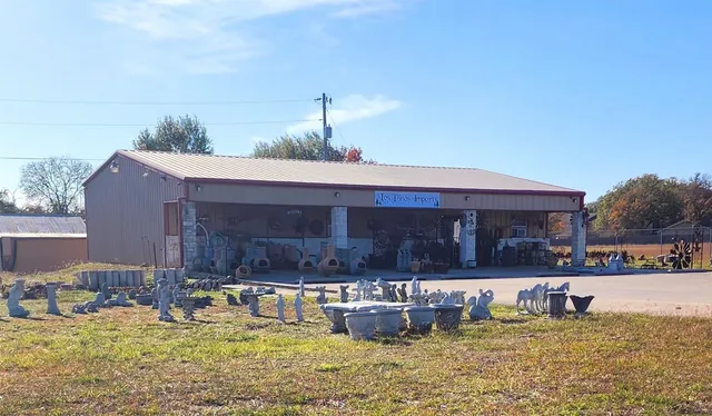 a view of a yard with large trees