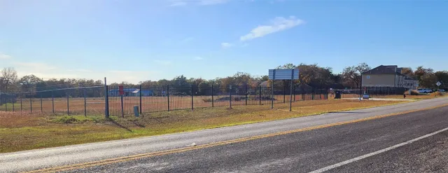 a view of a lake with houses in the background
