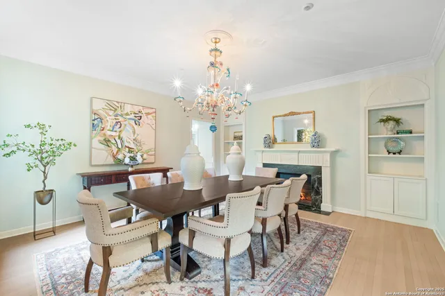 a kitchen with a sink cabinets and wooden floor