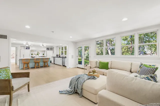 a large kitchen with a table and chairs