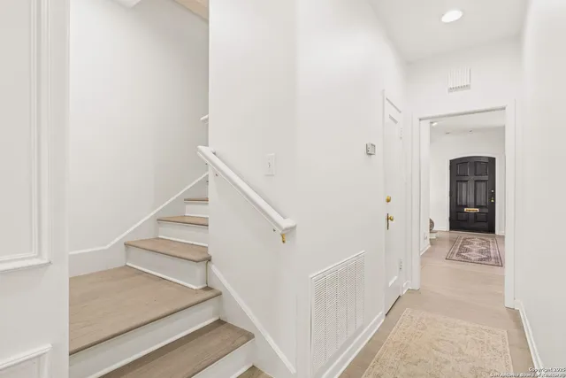a bathroom with a granite countertop sink a large mirror and a shower
