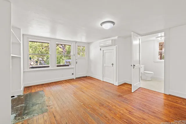 a bathroom with a toilet and a bathtub