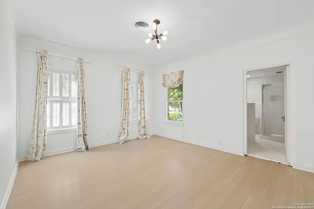 a big yard with lots of green space and trees