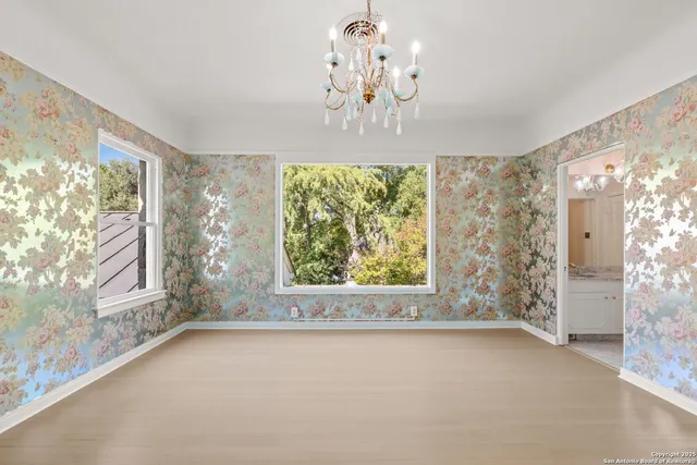 front view of a house with a tree