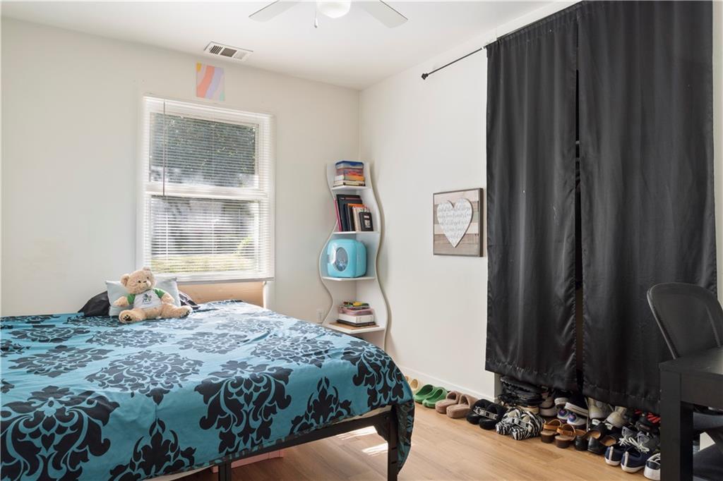 381 Lincoln Street Southwest Atlanta, GA 30315 - Photo 15 of 20 a bedroom with a bed dresser and a window