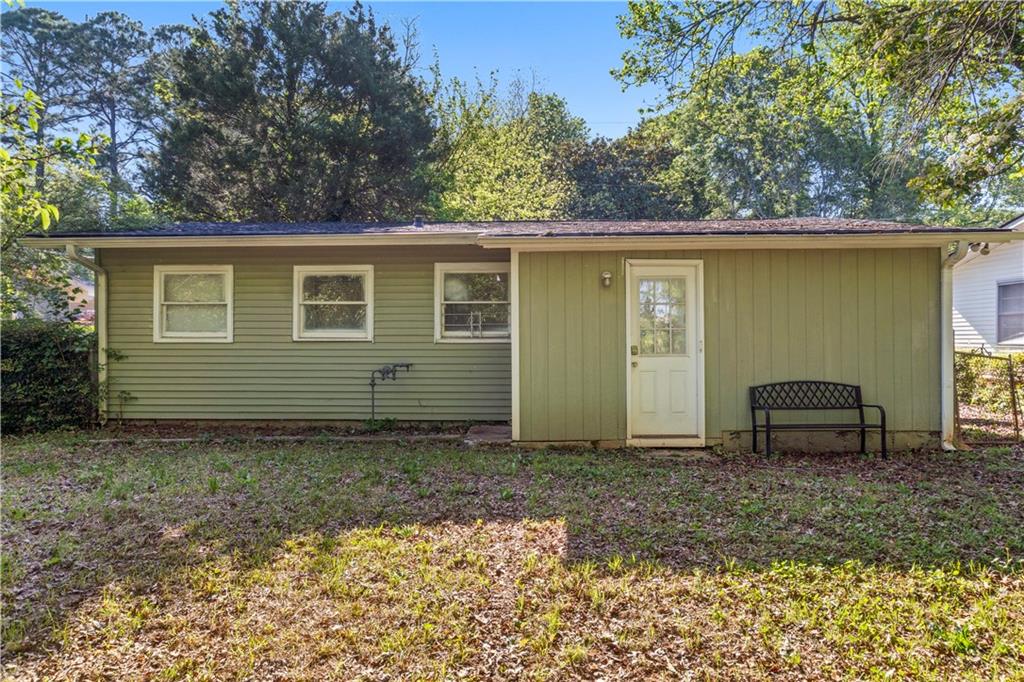 381 Lincoln Street Southwest Atlanta, GA 30315 - Photo 19 of 20 a view of a house with a yard and a table and chair