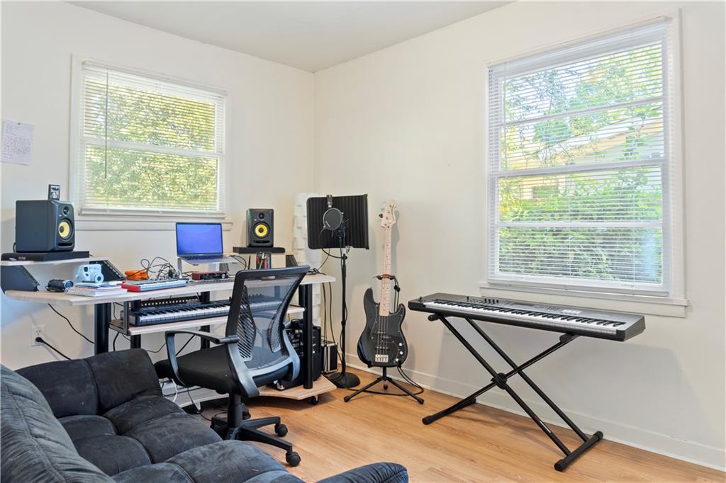 381 Lincoln Street Southwest Atlanta, GA 30315 - Photo 10 of 20 a view of a workspace with furniture and a window