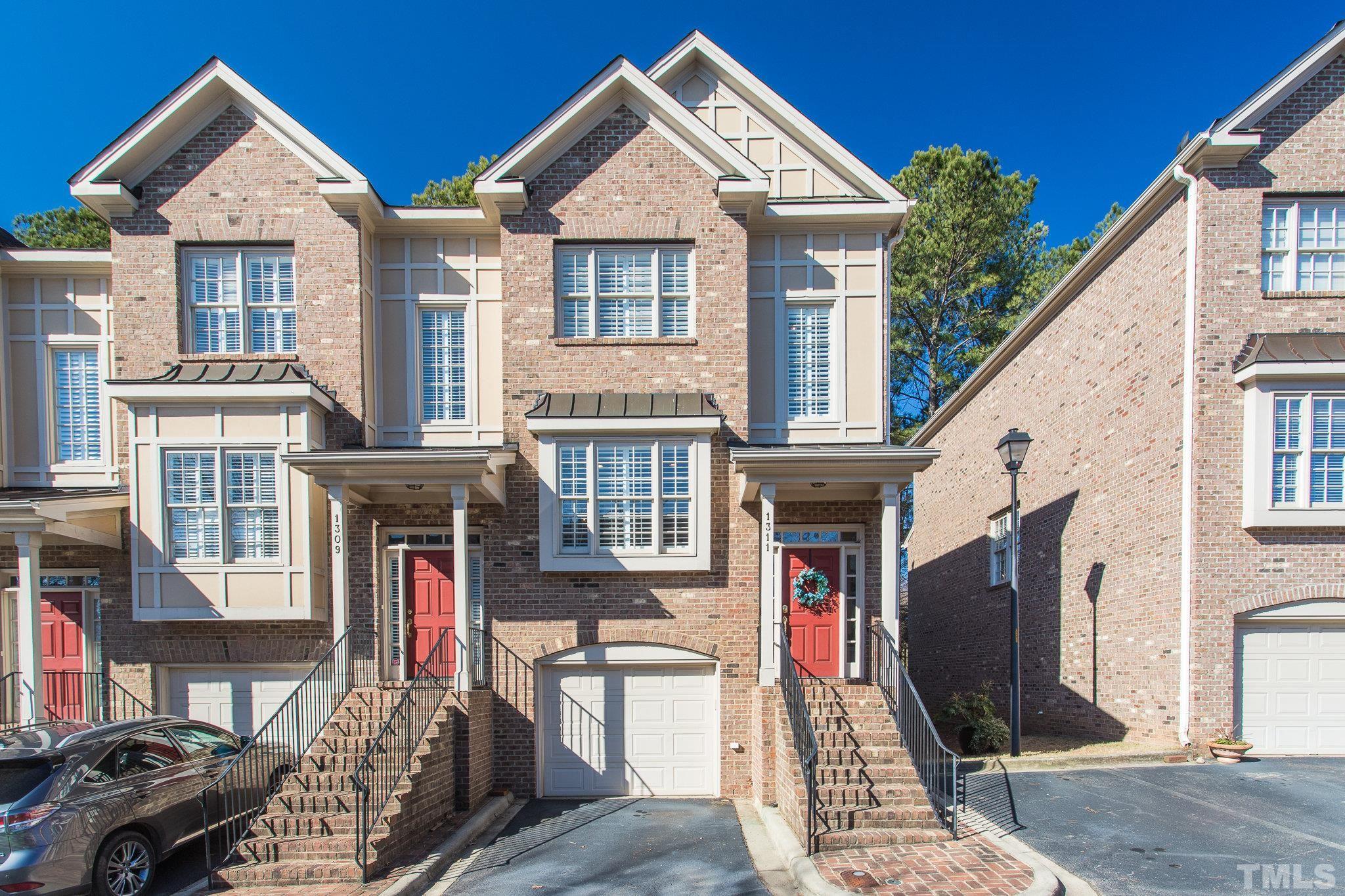 1311 Cameron View Court Raleigh, NC 27607 - Photo 1 of 33 a front view of a house with many windows