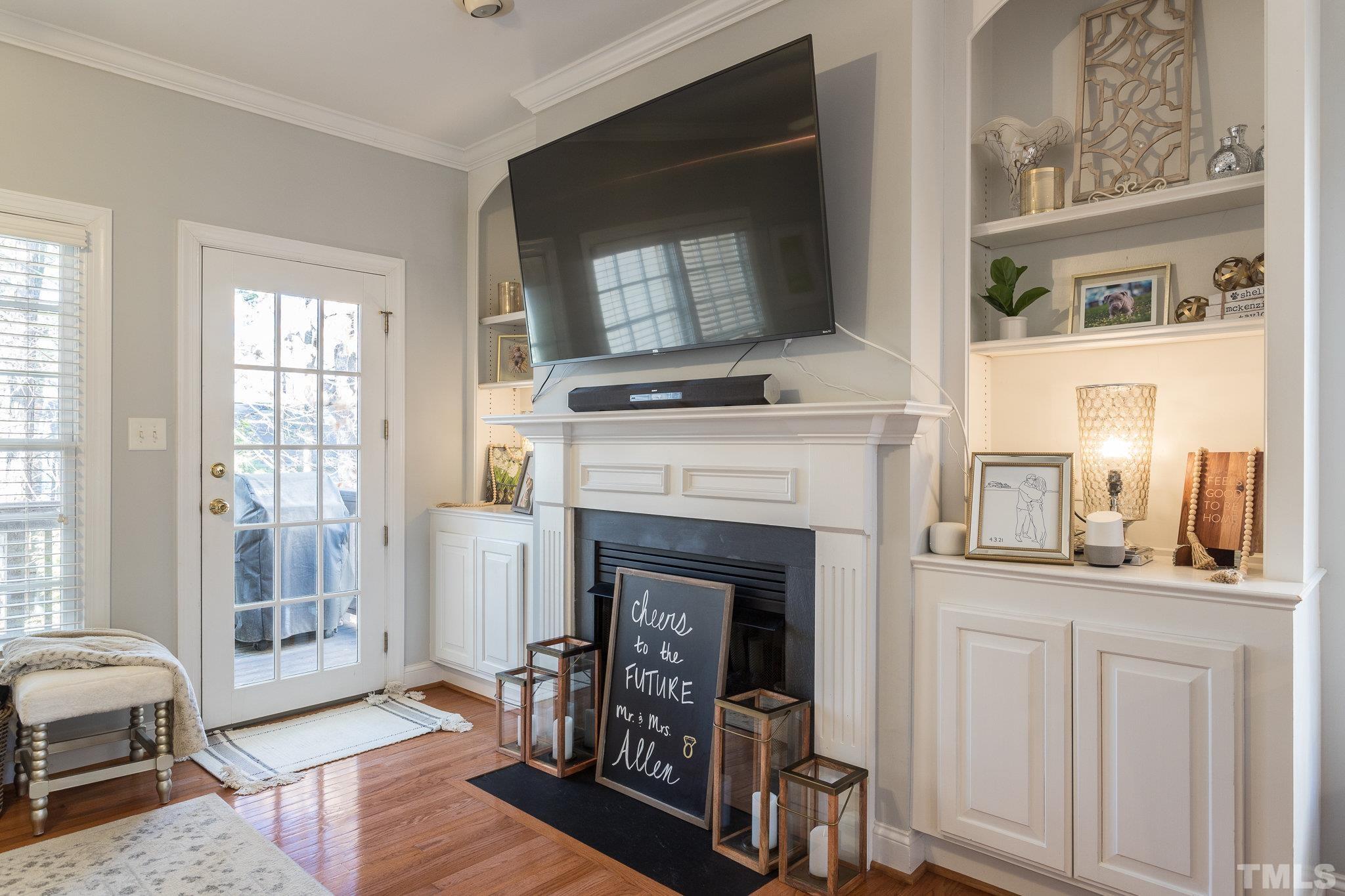 1311 Cameron View Court Raleigh, NC 27607 - Photo 13 of 33 a living room with furniture and a fireplace